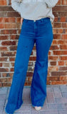 The Libby flared denim jeans w/ raw hem (medium/dark wash)